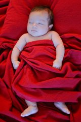 baby_in_red_sheets-01